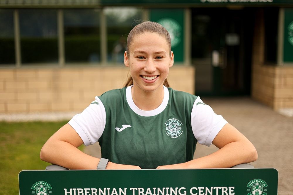 Tired Burchill poses in front of the Hibs training centre, via Hibernian