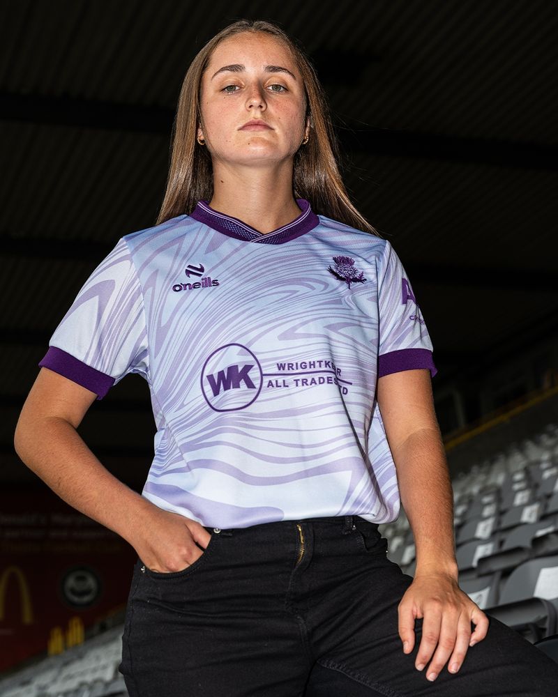 Partick Thistle player modelling the new lilac wavy away kit