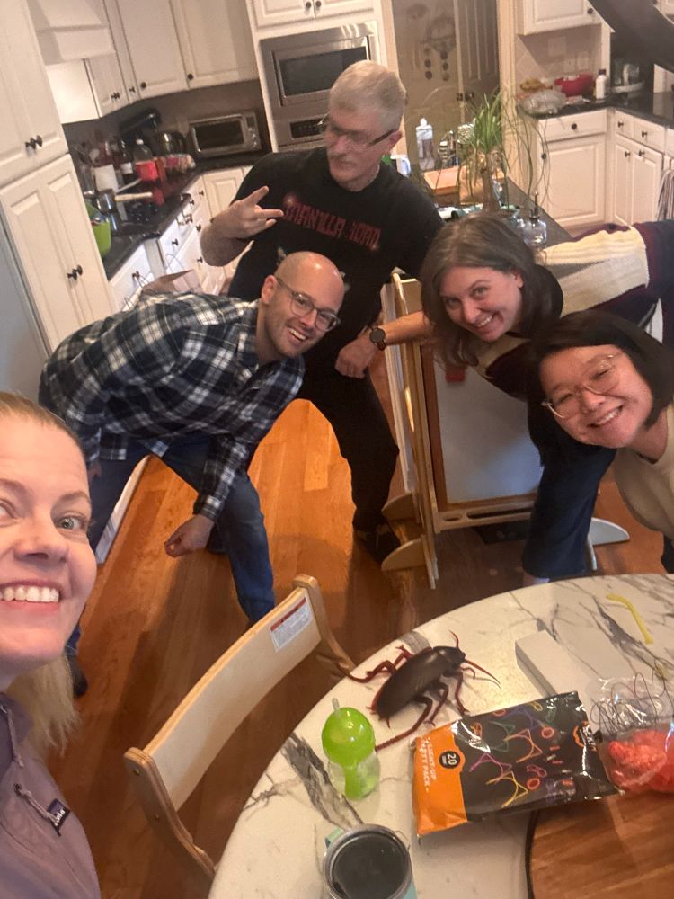 Group of five people smiling 