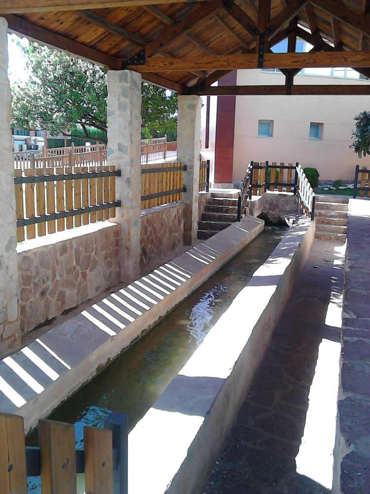 Public washing area in #Almenara, Spain. It's a long trough-like structure with sloping sides, to facilitate washing clothes. The water runs continuously through the trough. No longer used, as most people now have washing machines.