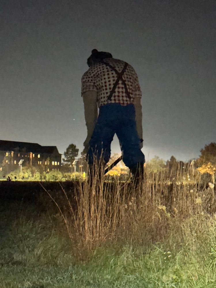 Paul Bunyan sculpture at night in 2023 from behind