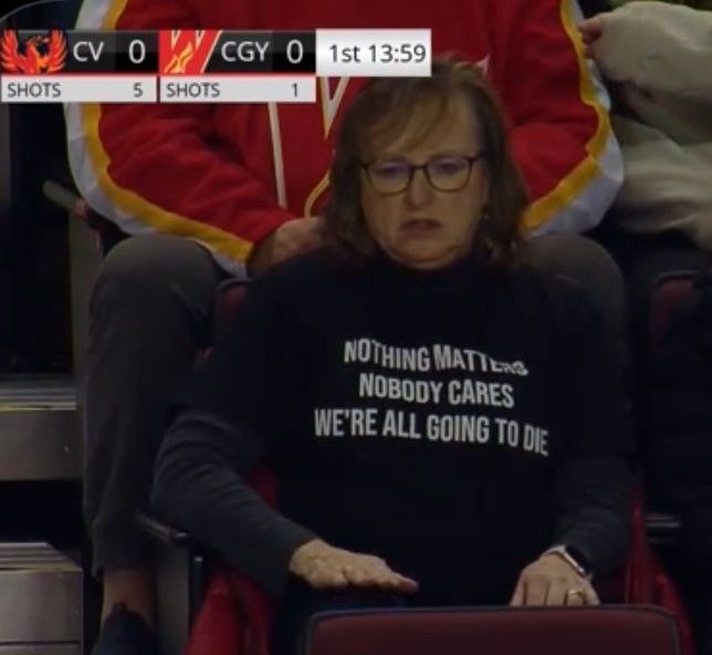 Lady at a sporting event wearing a “nothing matters; nobody cares; we’re all going to die” T-shirt 