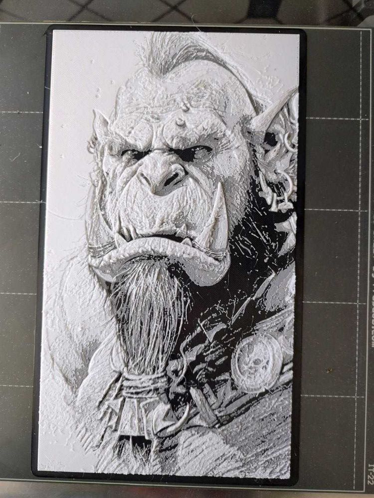 3D-Print of a World of Warcraft Orc, a head shot, looking back at the viewer.