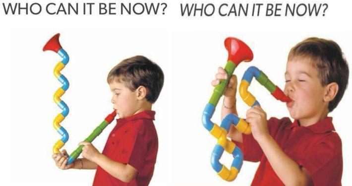 The lyrics "Who can it be now" twice, with a child playing a tube block instrument that has a shape reminiscent of the saxophone from the song "Who Can It Be Now?" by Men At Work