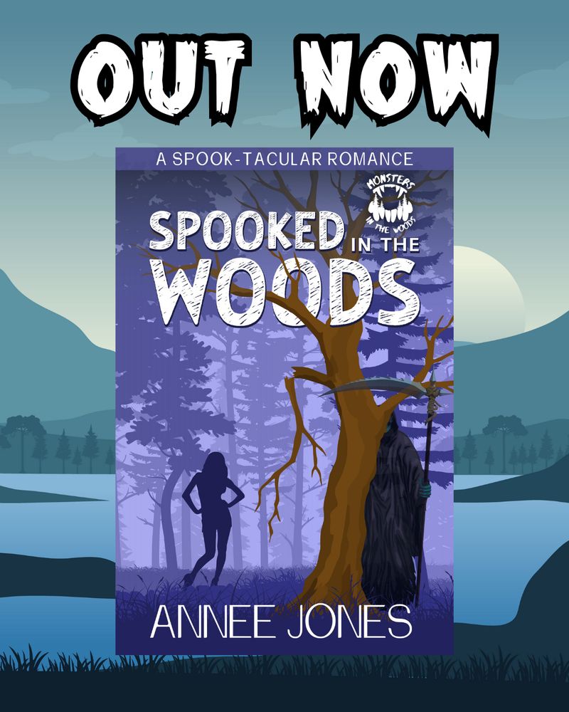 Digital flyer declaring "OUT NOW!" for the novella "Spooked in the Woods: A Spook-Tacular Romance", by Annee Jones. The light purple-toned cover is displayed over a blue-toned mountainous background. Above, "out now" is written in large, white lettering.