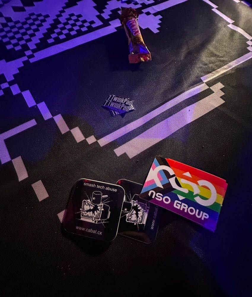 photo of stickers on a table at 38c3.