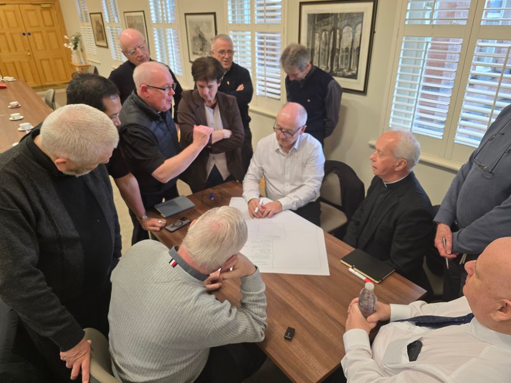 Photo of Roisn Kelly delivering training to priests and deacons from Down & Connor Diocesan Trust.