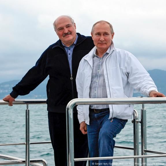 Putin and lukashenko looking lowkey kinda gay and twinky they are standing on a boat with the sea as thier background