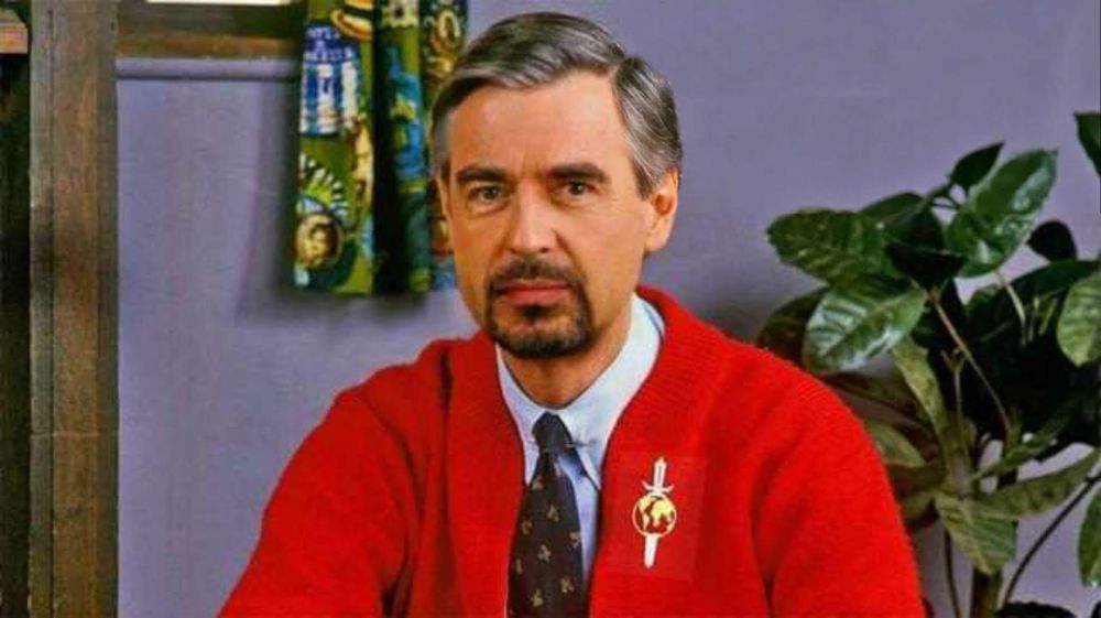 Image of Fred Rogers with a goatee and wearing a red cardigan with a Klingon lapel pin. The bat'leth used to eviscerate fascists prior to bathing in their blood is just out of frame.