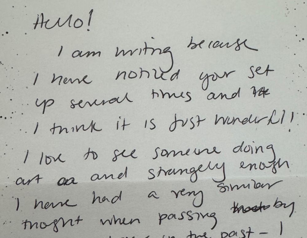 A casual and friendly handwritten note expressing joy and solidarity at seeing someone creating art in the neighborhood.