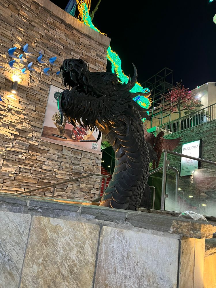 The head of a Chinese dragon in a fountain, coloured bronze 