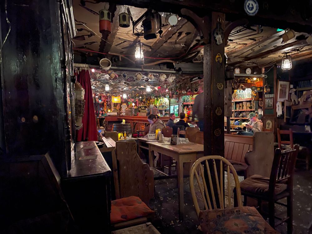 Inside of an Irish pub. Saw dust on the floor, lots of decorations - generally “cottage core pub”.