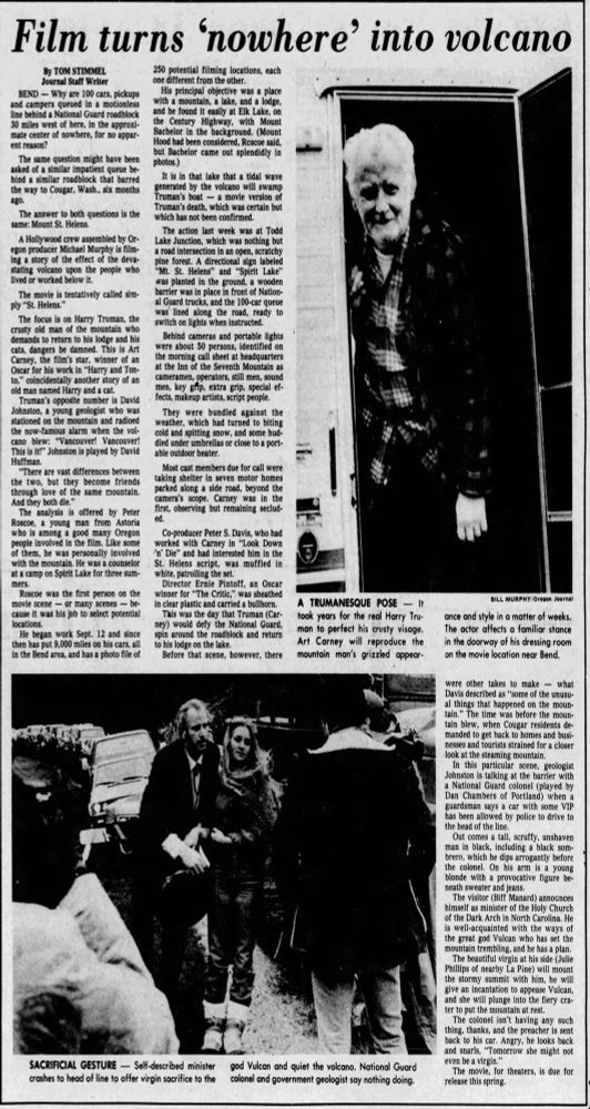 Full-page feature from the Oregon Journal, Nov. 11, 1980, documenting location shooting for St. Helens near Bend. Images include Art Carney standing in the doorway of his dressing-room trailer in a plaid jacket and hat, and a staged scene at a National Guard roadblock involving extras portraying a self-styled minister and a “virgin sacrifice” brought to appease the volcano. The article details the production’s use of Todd Lake, Elk Lake and Bachelor Butte as stand-ins for Spirit Lake and the blast zone.