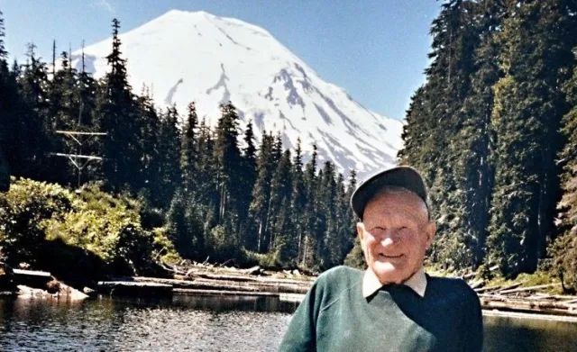 Harry Truman on the boat dock of his resort with Mount St. Helens in the background.

Taken in 1979 by George Barker.
