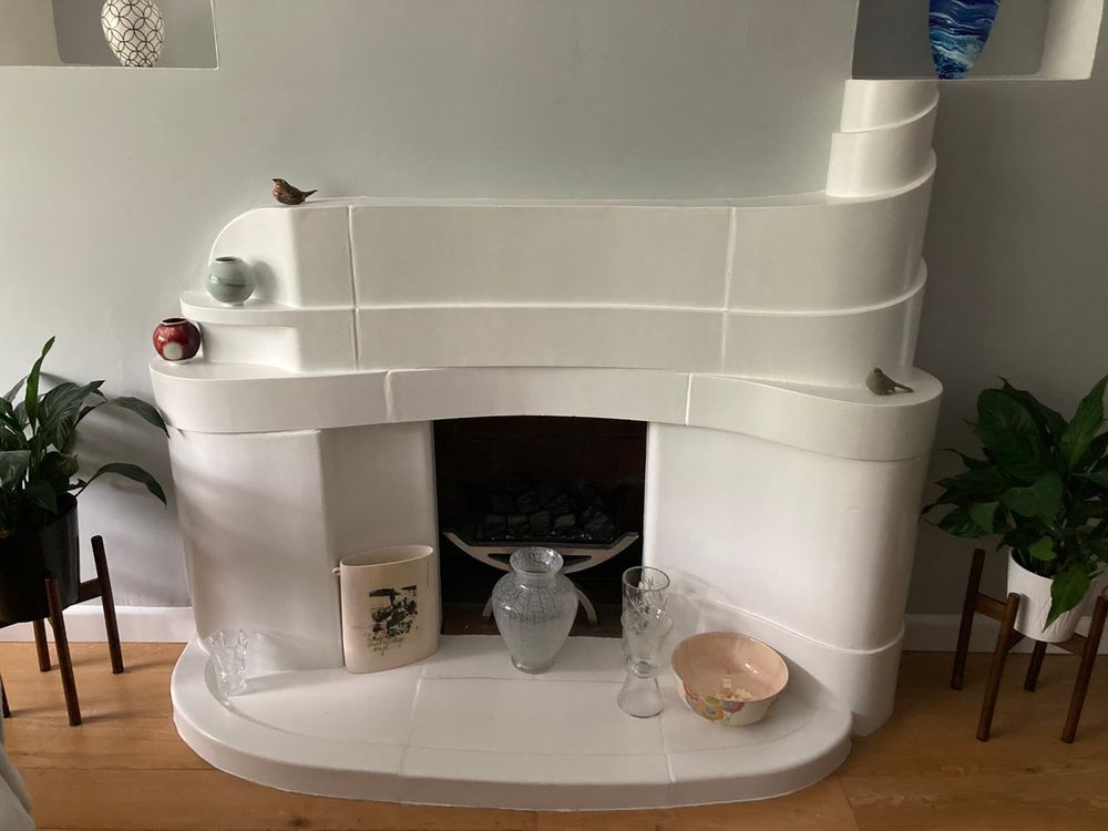 Off-white tiled streamline moderne Art Deco fireplace from Kelvin Court in Glasgow, courtesy of Patricia Ferguson. Kelvin Court on Great Western Road, Anniesland, in the north west of Glasgow was completed in 1938, and designed by architect James Newton Fatkin.