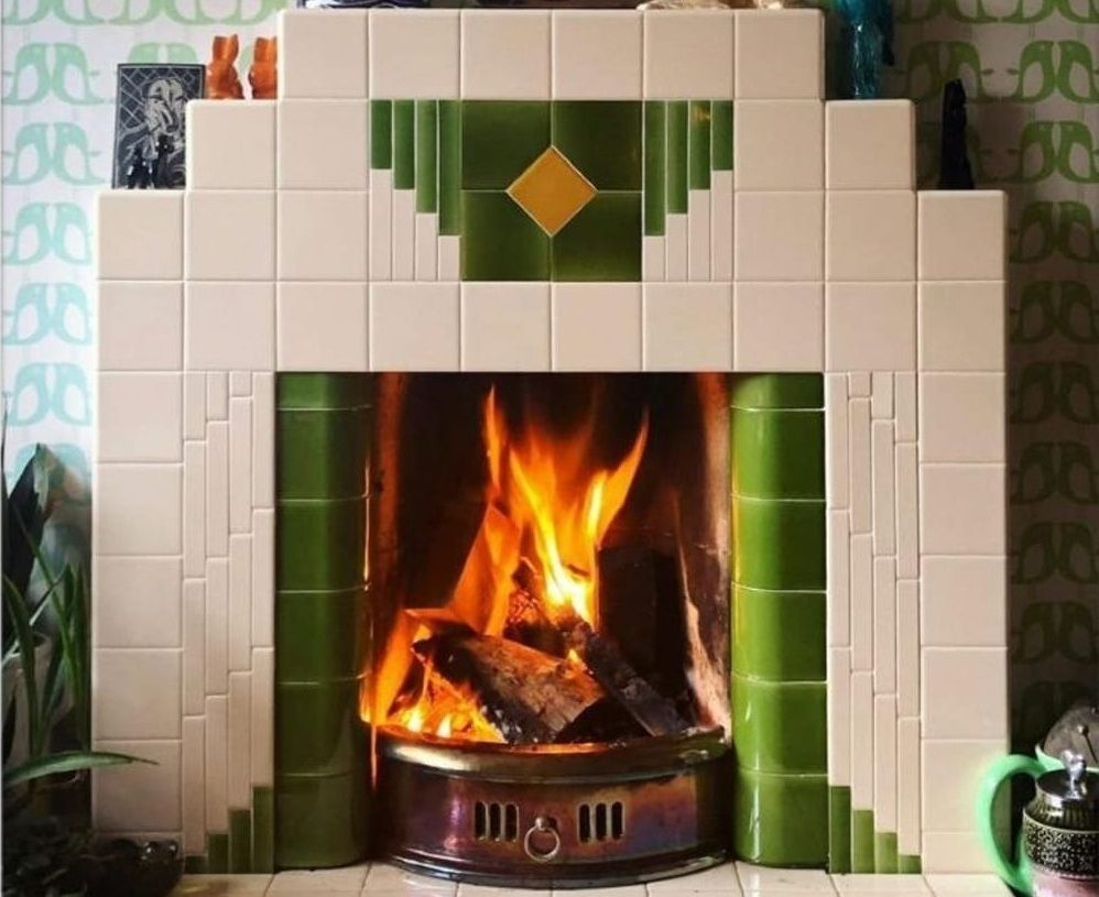 Cream, green and gold-tiled Art Deco fireplace courtesy of Edward Elderman, USA, on X.