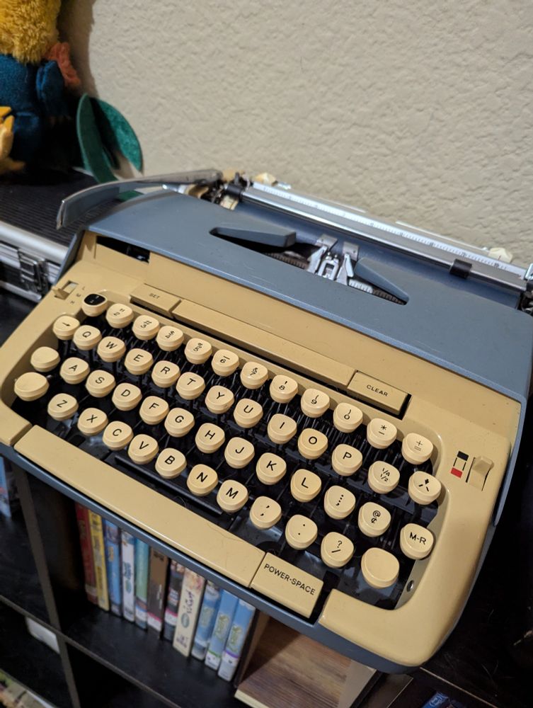 A blue and cream typewriter 