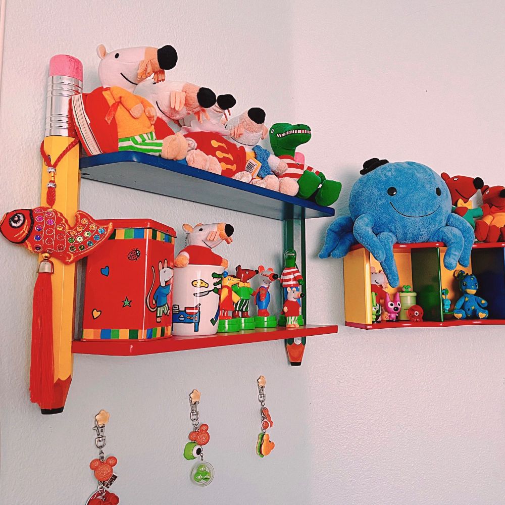 A picture of shelves with maisy the mouse merchandise