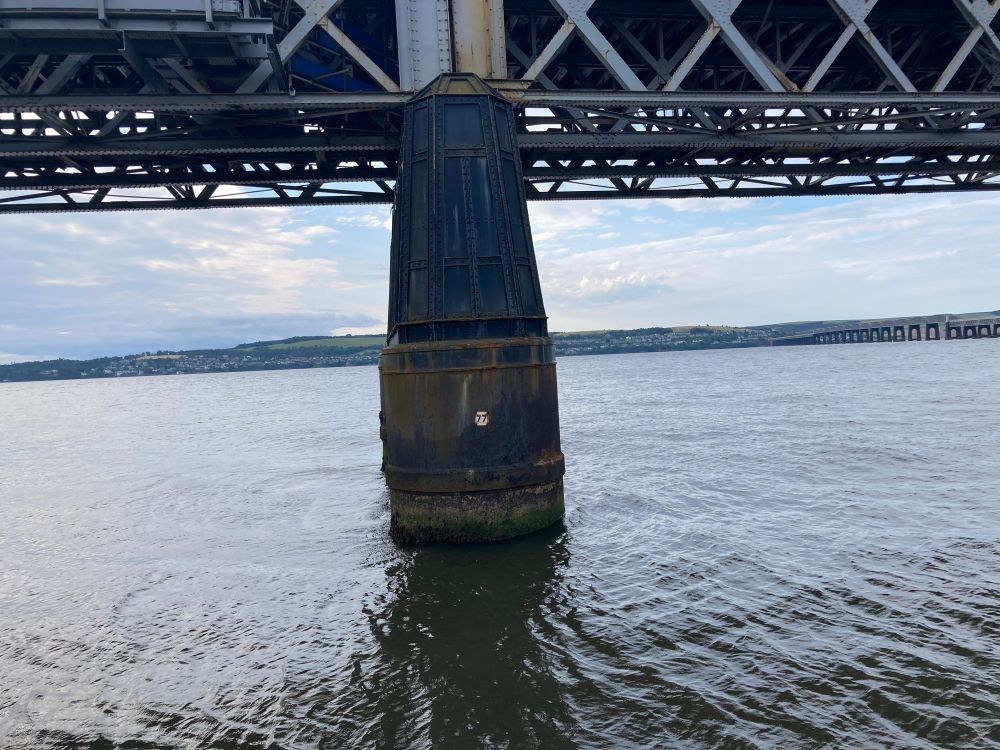 View of Tay Firth directly at a pylon for the rail bridge at high tide