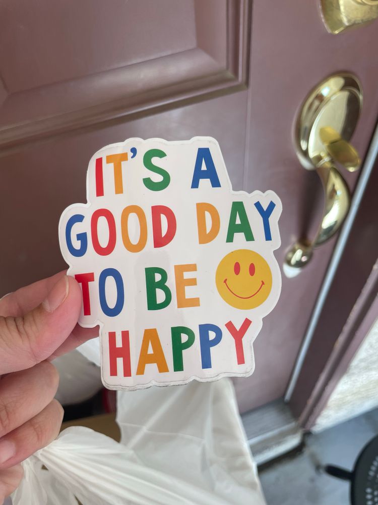 Cute sticker saying it’s a good day to be happy