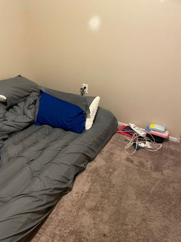 Air mattress and a bunch of cords and consoles next to it