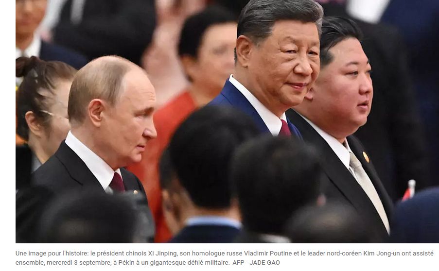 Picture shows (from left) Putin (looks like a decreasing moon), Xi Jinping (looks like a square moon) and Kim Jong Un (looks like a full moon), plus a corowd of blurred faces in the background.