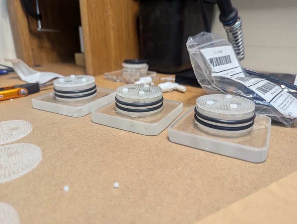 Three respirometry caps fitted with O-rings and baffle plates. Only missing the tube connectors at the back.