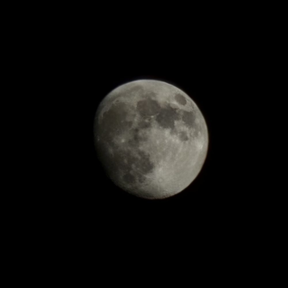 Picture of the moon zoomed in by 30x. It's in the waxing gibbous phase. 