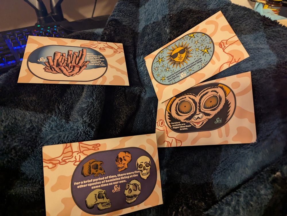 SciShow backer post cards with different facts.