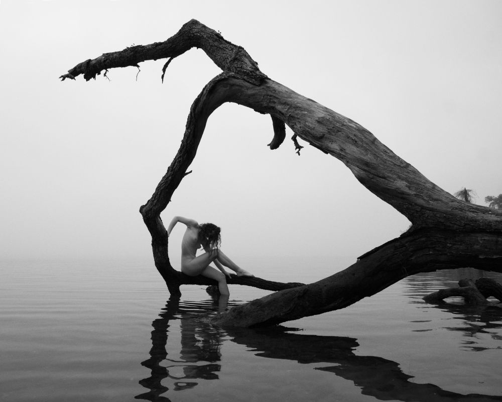 Christina is nude posing on a large stretch of deadwood in the Bay. Very heavy fog can be seen in the background. 

If I remember correctly, we left in part bc it was getting chilly and also bc the fog was just getting too heavy.
