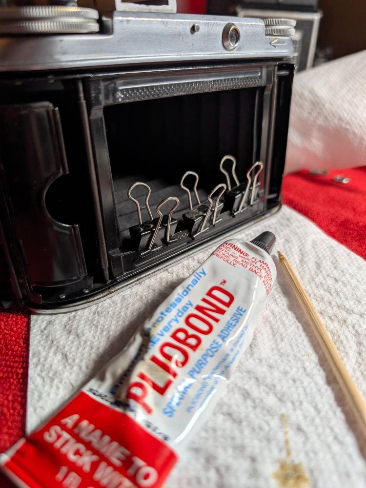 Pliobond + binder clips + camera bellows 