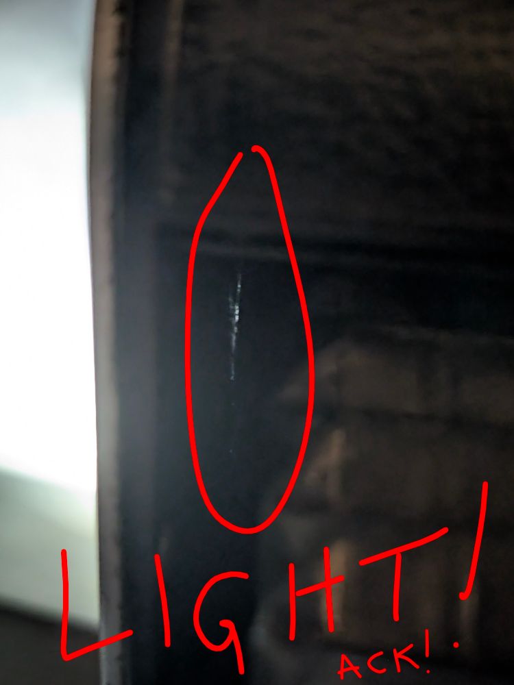 Fig 3 - the light leak spot as seen from the front of the camera with a flashlight shining into the body from behind. 