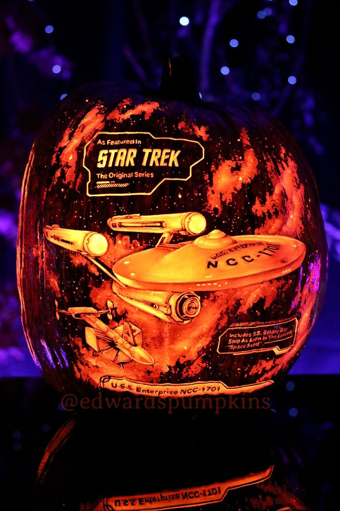 Hand carved portrait of light of the NCC-1701 starship Enterprise as seen in Star Trek the Original Series. The light comes from carving into the pumpkin, the deepest parts are the brightest, shaping the light into an illusion of 3D realism. 