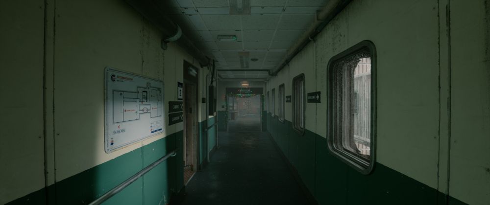 Screenshot of a corridor in 'Still Wakes the Deep' video game.