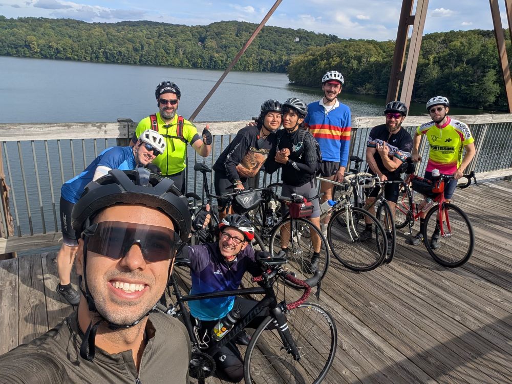 Bike people on reservoir bridge after 65 miles 