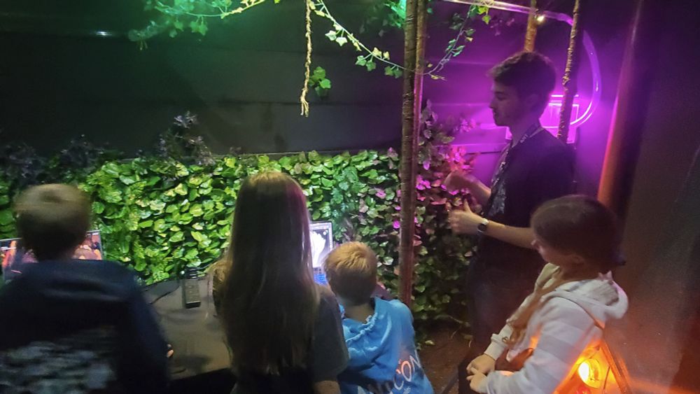 Young visitors to the Empires of the Undergrowth booth at AntCon 2025.