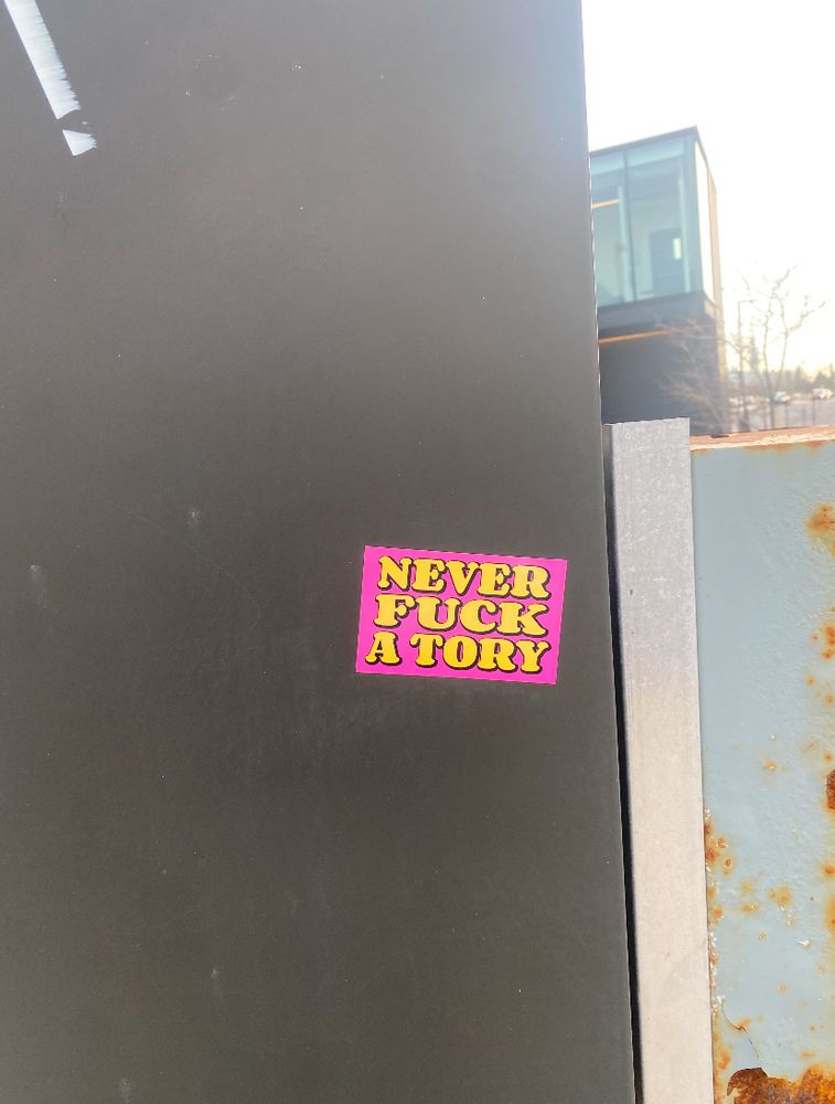 Sticker in urban area that reads “ never fuck a Tory”