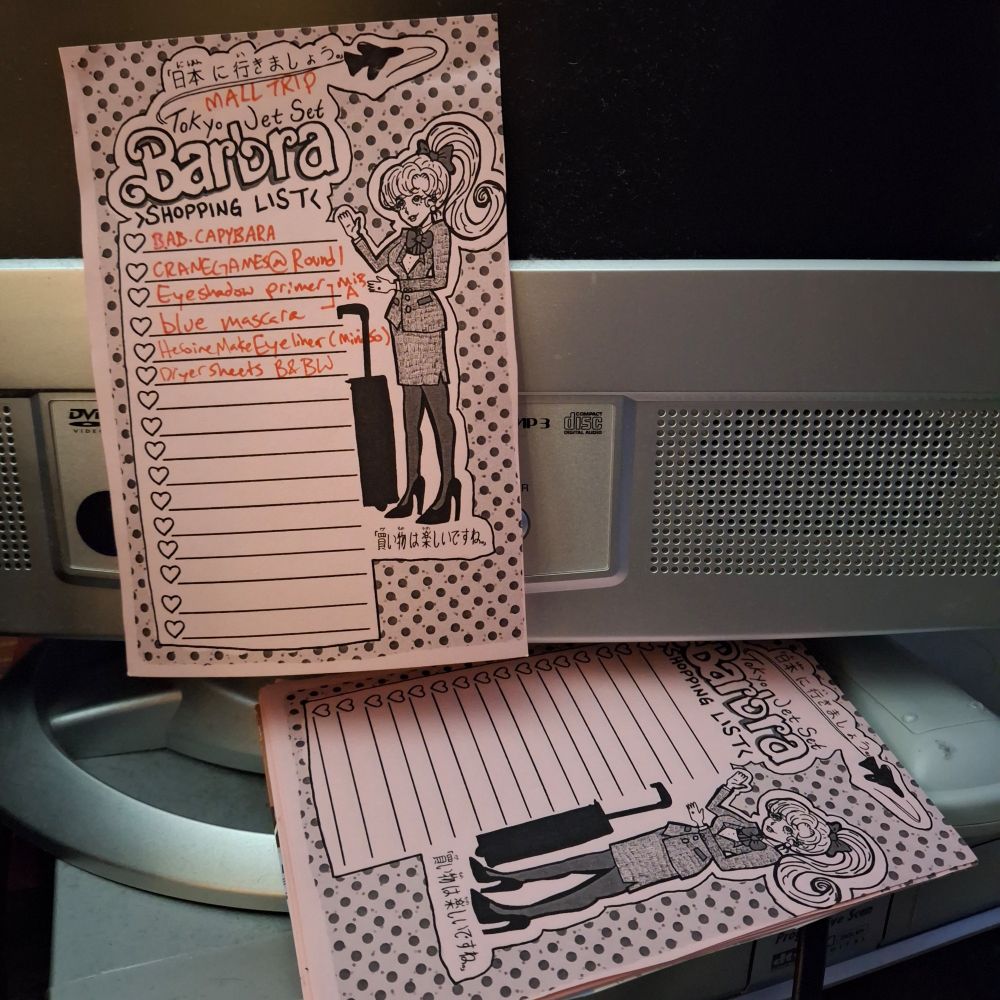 I made post-it style note pad w the design mentioned in previous post this photo shows one page stuck to a screen to show off the repositionable adhesive while the pad itself laying beneath it to show off how shitty the alignment is on the side cos my hands are dumb and so is my paper cutter