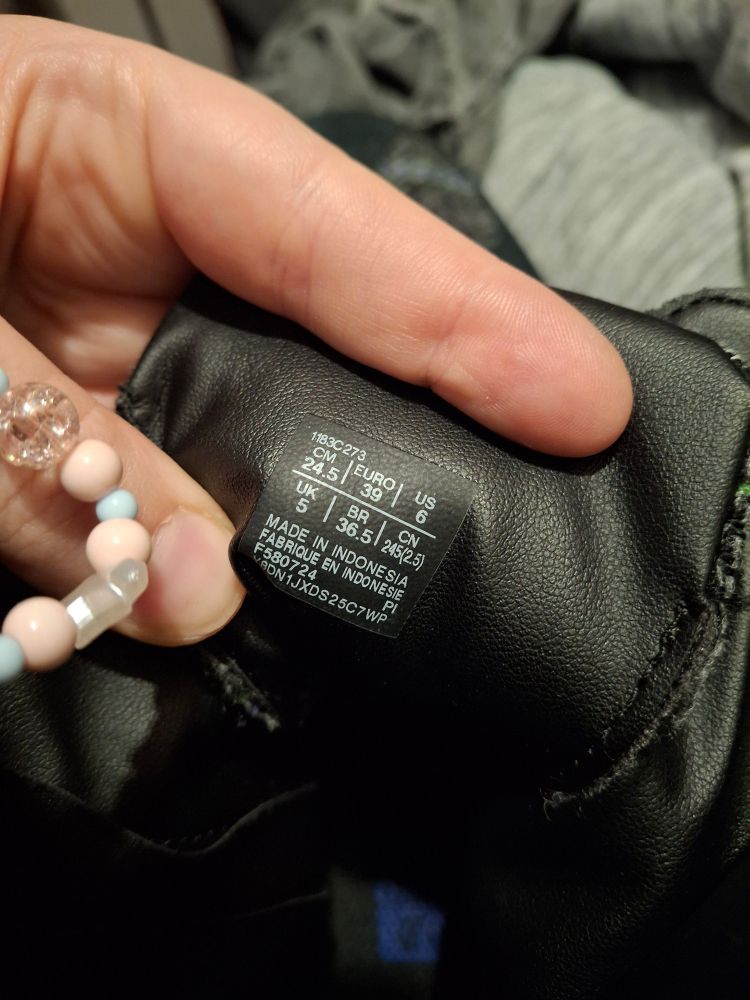 Inside tag with sizing and manufacturing info that also looks a bit cheaper than purported worth