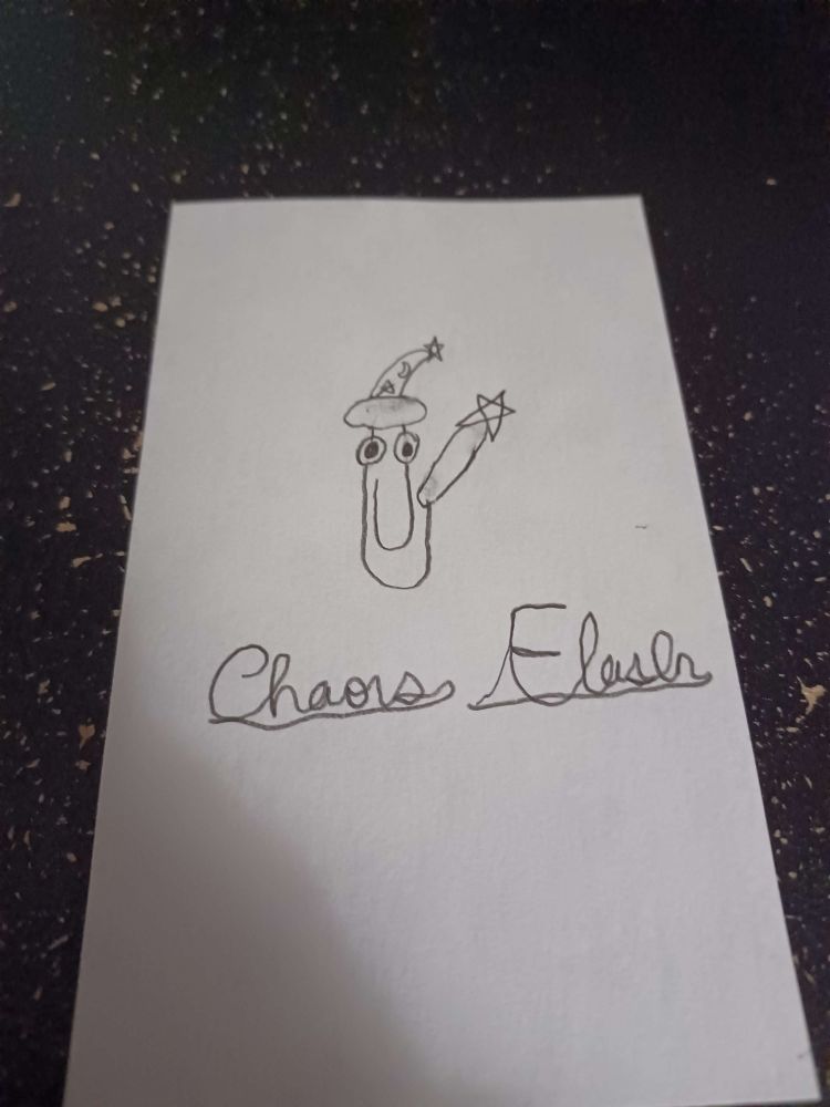 A drawing on the back of a flashcard showing Microsoft Office's Clippy wearing a wizard hat and holding a wand.