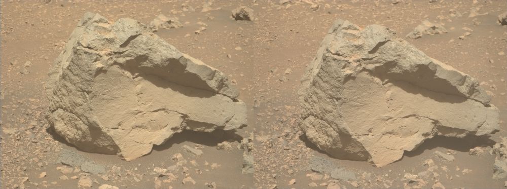 A dual left/right stereoscopic pair of ochre-toned photographies capturing a Martian rock. This dual image is intended to be used to obtain a Stereo3D rendition of the scene through parallel viewing, and not cross-eyed viewing.