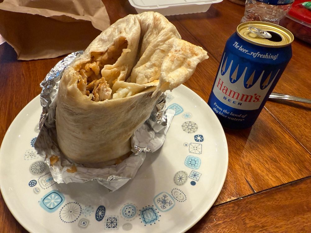 Big burrito and open can of Hamm’s 