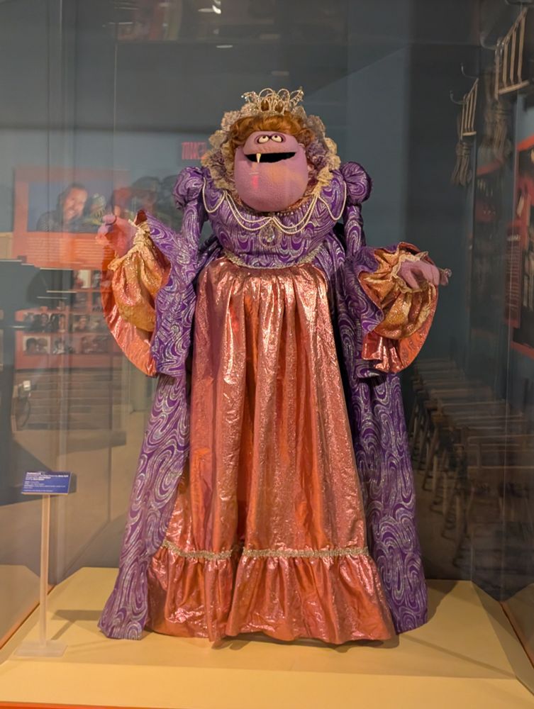 Taminella puppet from the Henson Frog Prince movie. A tall, purple witch puppet with a pointy snaggle tooth.