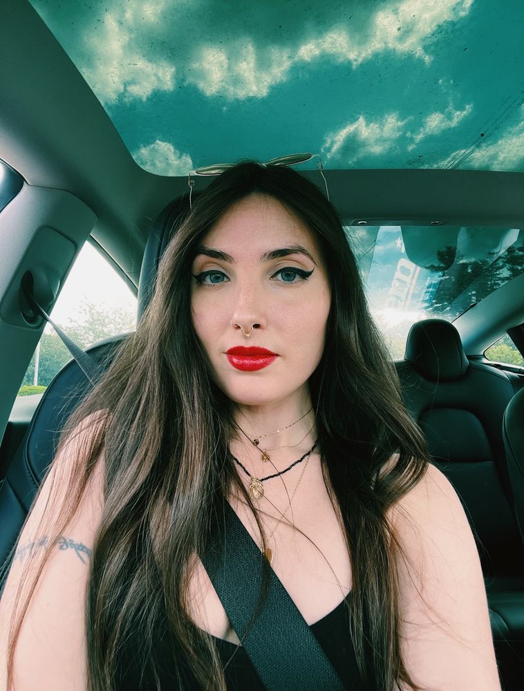 Brunette car selfie