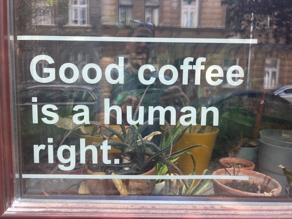 Sign in a window that says, “Good coffee is a human right.”