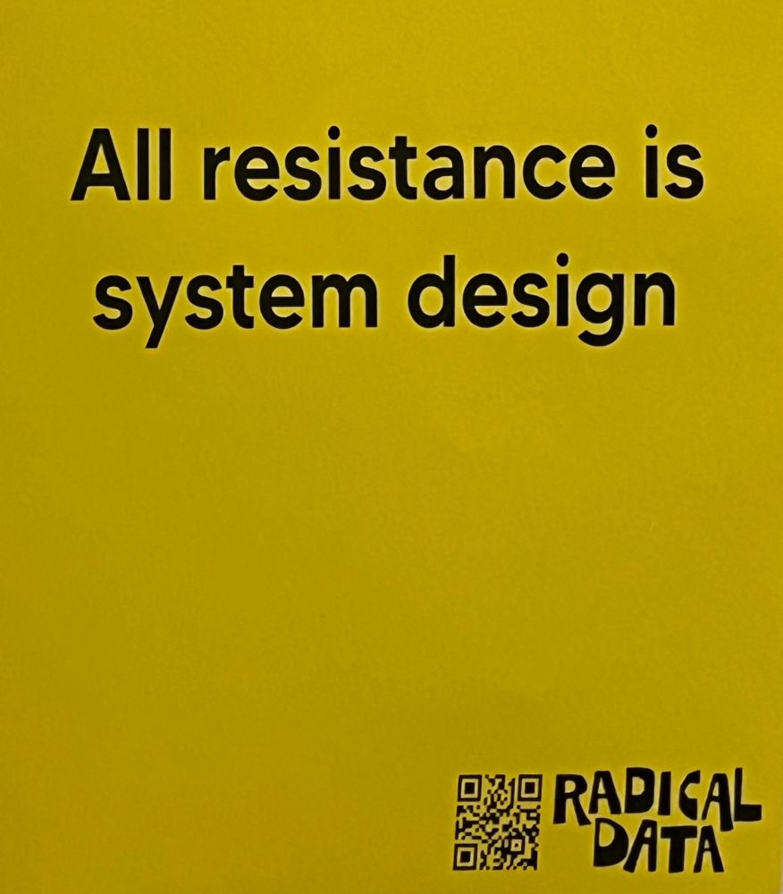 Sign saying All resistance is system design. 