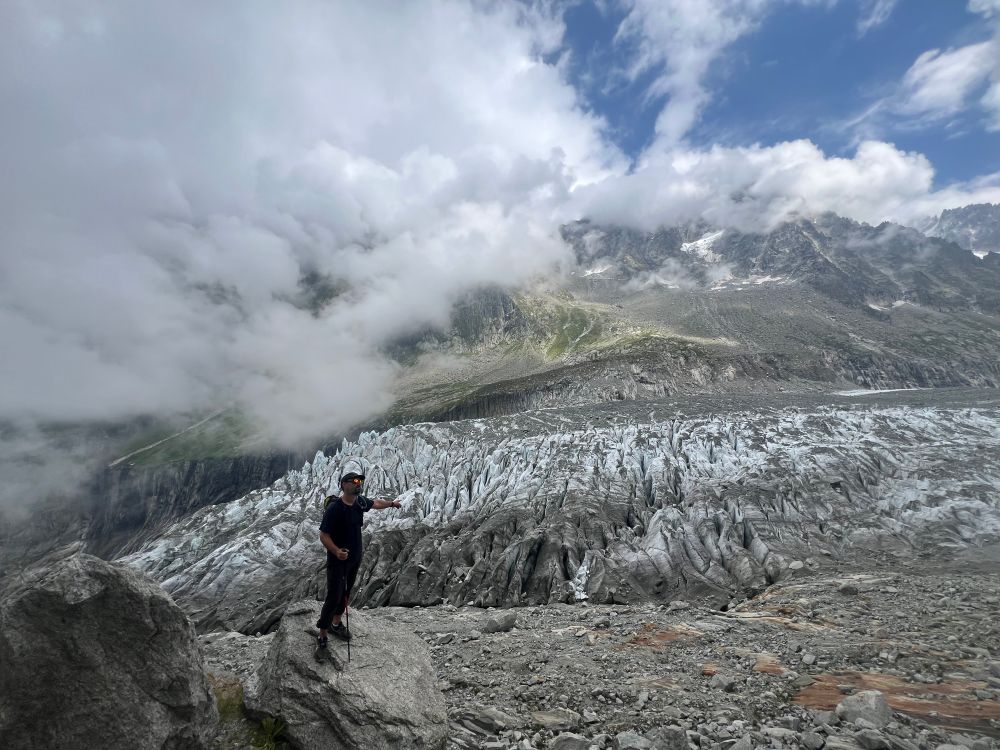 Man pointing at glaciers 