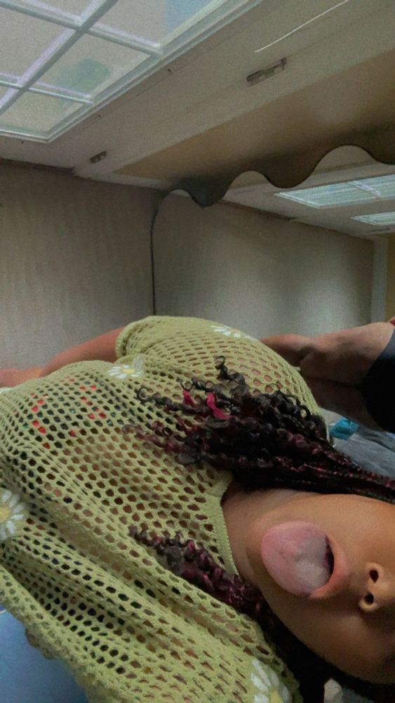 Me in a green swimsuit cover and my tongue out. If you look closely you can see my ass in the mirror🤭 