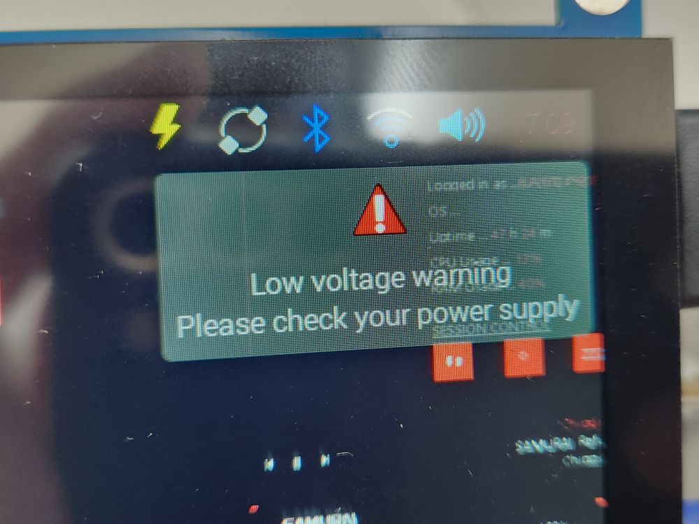 Close up photo of a screen showing a low voltage warning