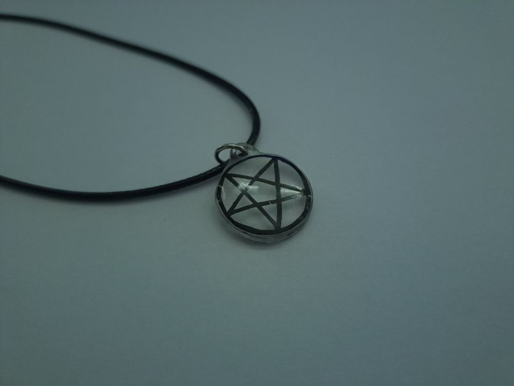 a pentagram necklace made of resin